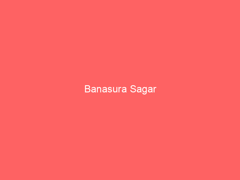A coral background with Banasura Sagar centered reflects the Wayanad destination known as India’s largest earthen dam amid mist-clad hills.